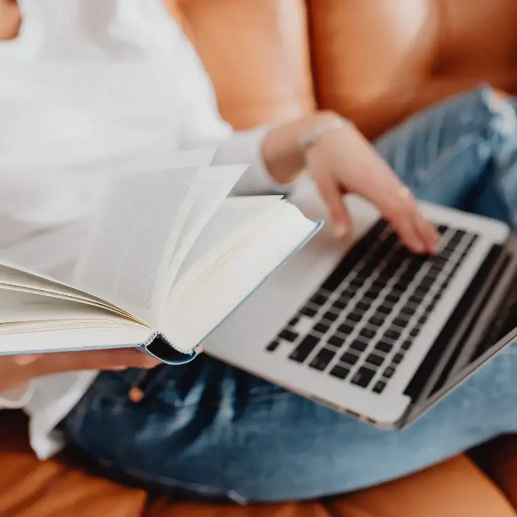 Adoptive Parent Book Club Image of Girl reading a book on computer